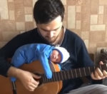 Dad Plays Guitar While His Baby Lies on Top of It