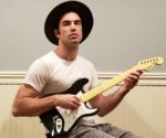 Erik John is Putting a Hilarious Twist on Iconic 2000s Rock Videos